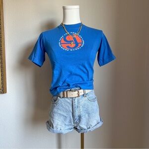 Blue graphic cropped tee with orange accents